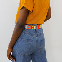 Close up of back side of Multi Arrows Beaded Leather Belt on model.