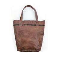 Brown leather tote bag with brown rainbow beaded circles along the top.