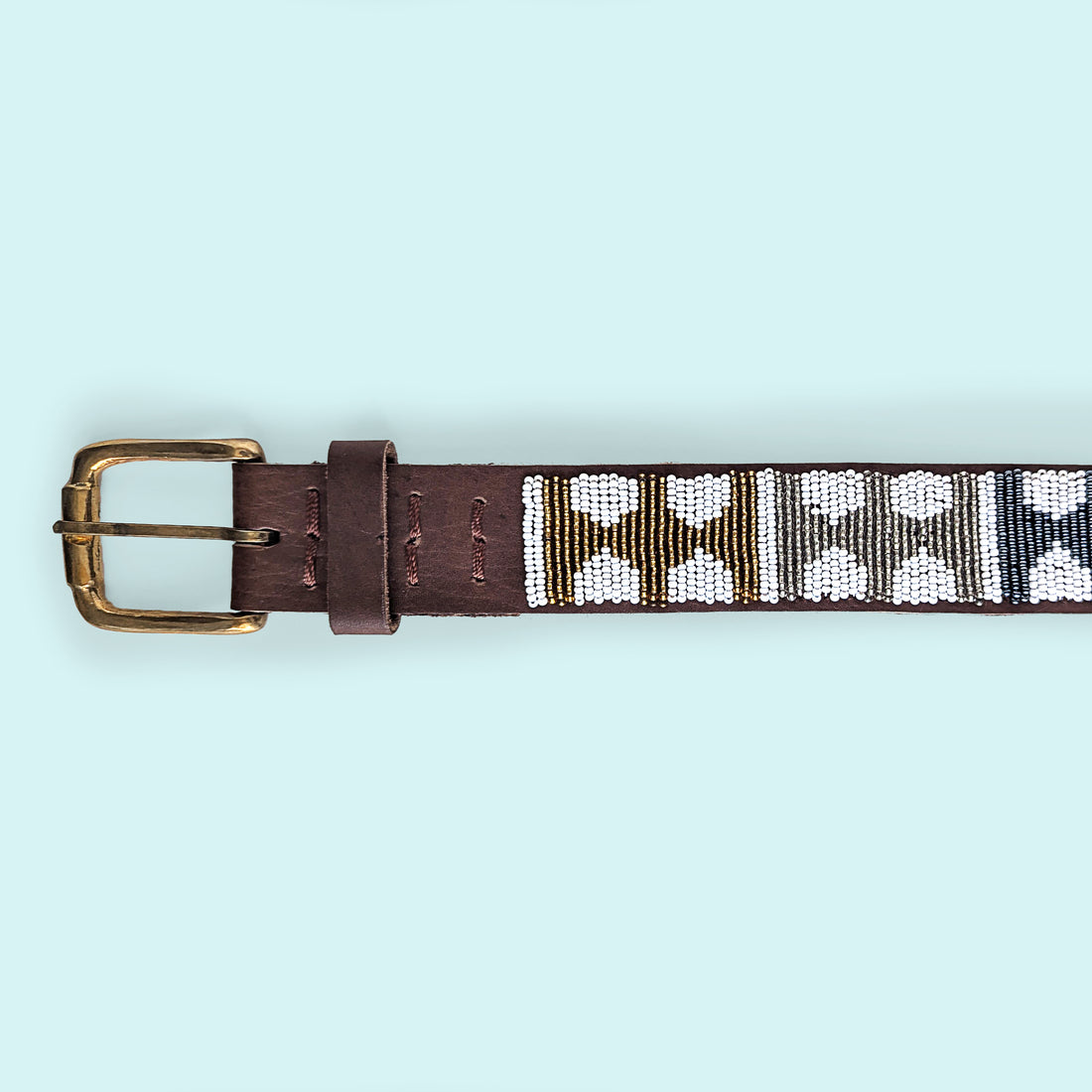 Close up photo of Arrows Metallic Beaded Leather Belt and brass belt buckle.
