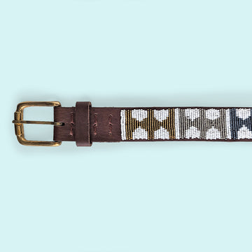 Close up photo of Arrows Metallic Beaded Leather Belt and brass belt buckle.