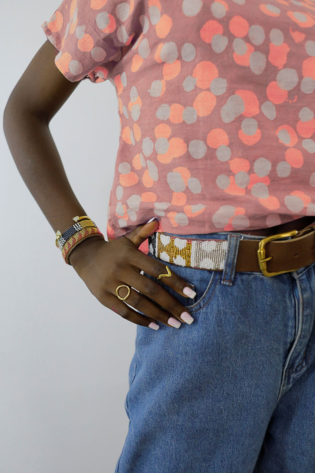 Photo of Arrows Metallic Beaded Leather Belt on model.
