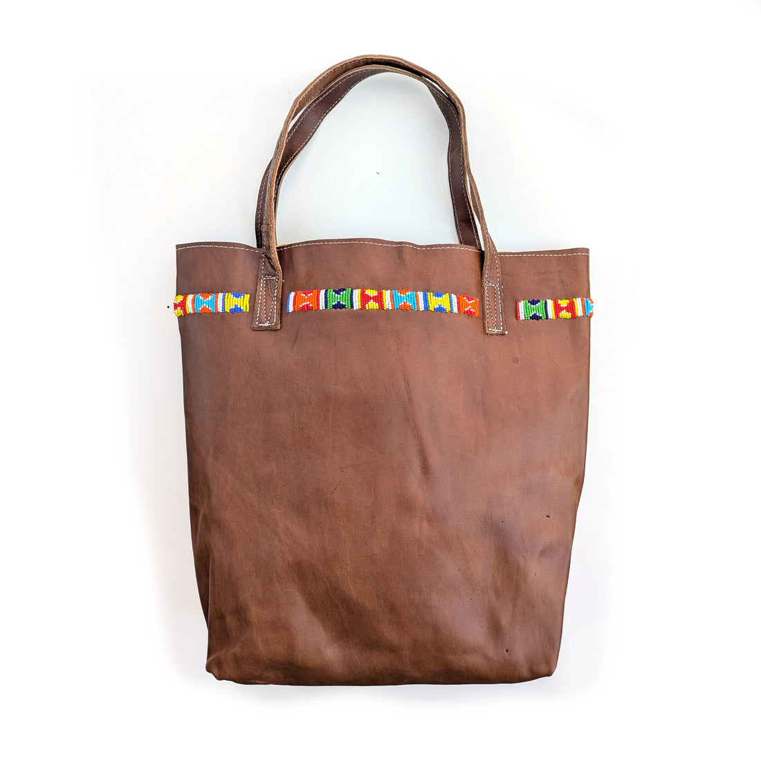 Leather tote bag with colorful geometric beaded design along the top.