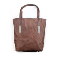 Brown tote bag with silver beaded accents on a white background