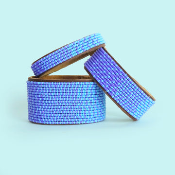 Group photo of large, medium and small Ombre Light Blue and Ocean Beaded Leather Cuff
