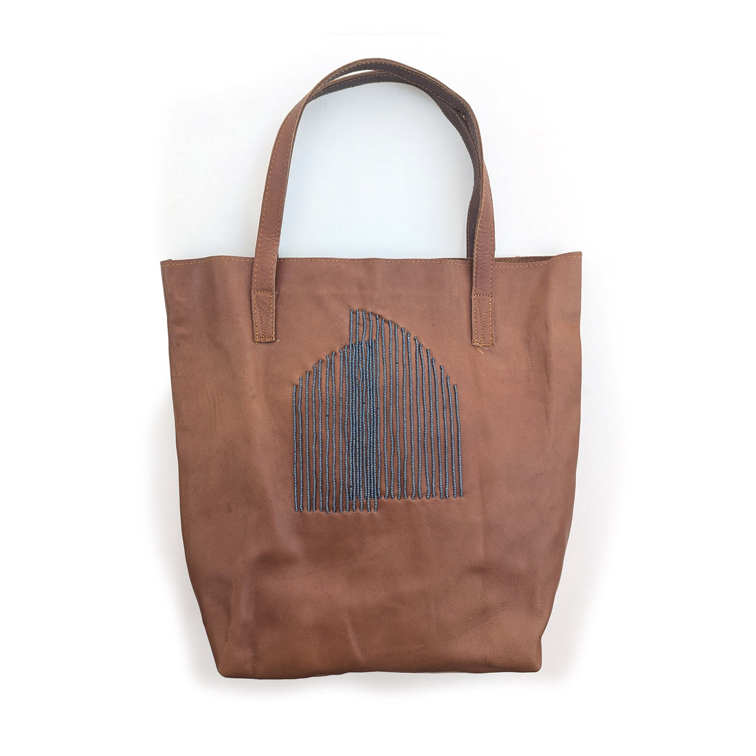 Brown leather tote bag with slate arc beading.