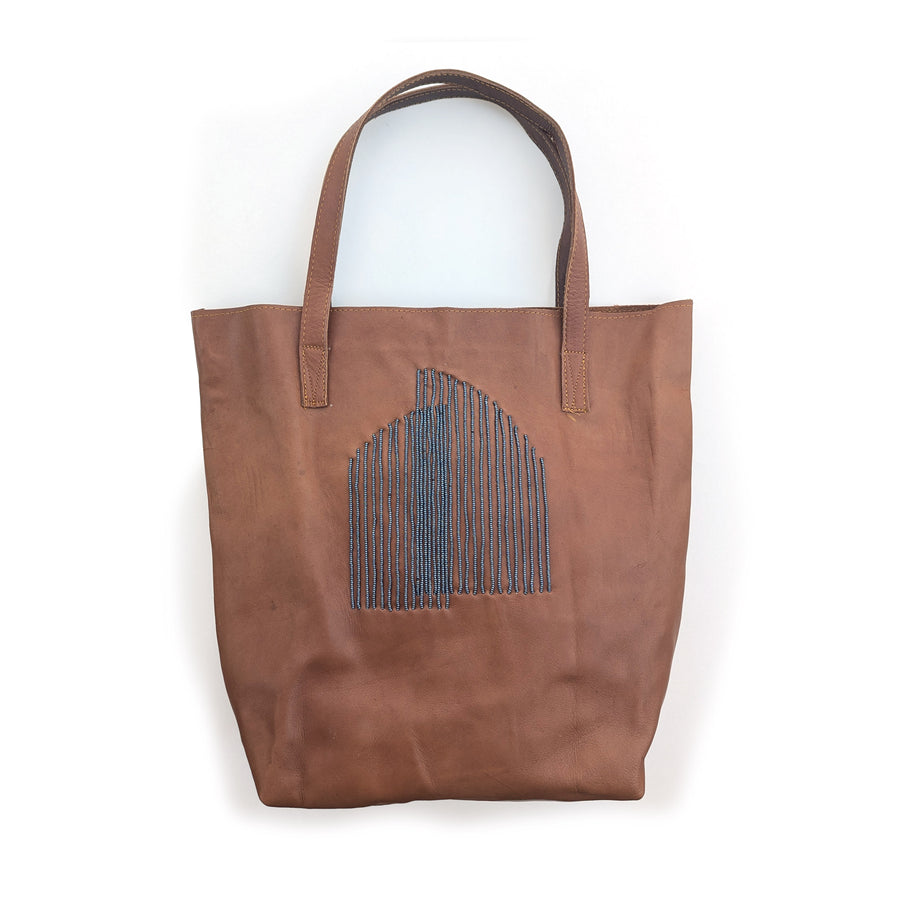 Brown leather tote bag with slate arc beading.