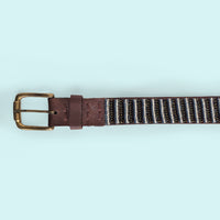 Close up photo of the Neutral Stripes Beaded Leather Belt and brass buckle.