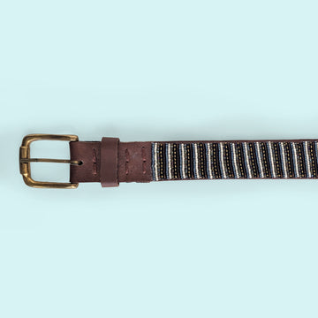 Close up photo of the Neutral Stripes Beaded Leather Belt and brass buckle.
