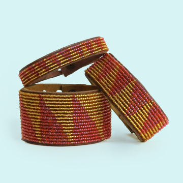 Group photo of large, medium and small Tri Coral and Gold Beaded Leather Cuff