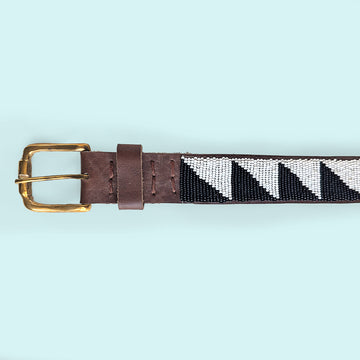 Close up picture of Black and White Tri Beaded Leather Belt and brass belt buckle.