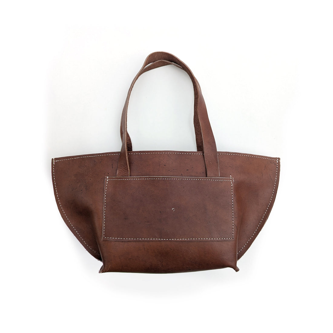 Brown leather shoulder bag on a white background